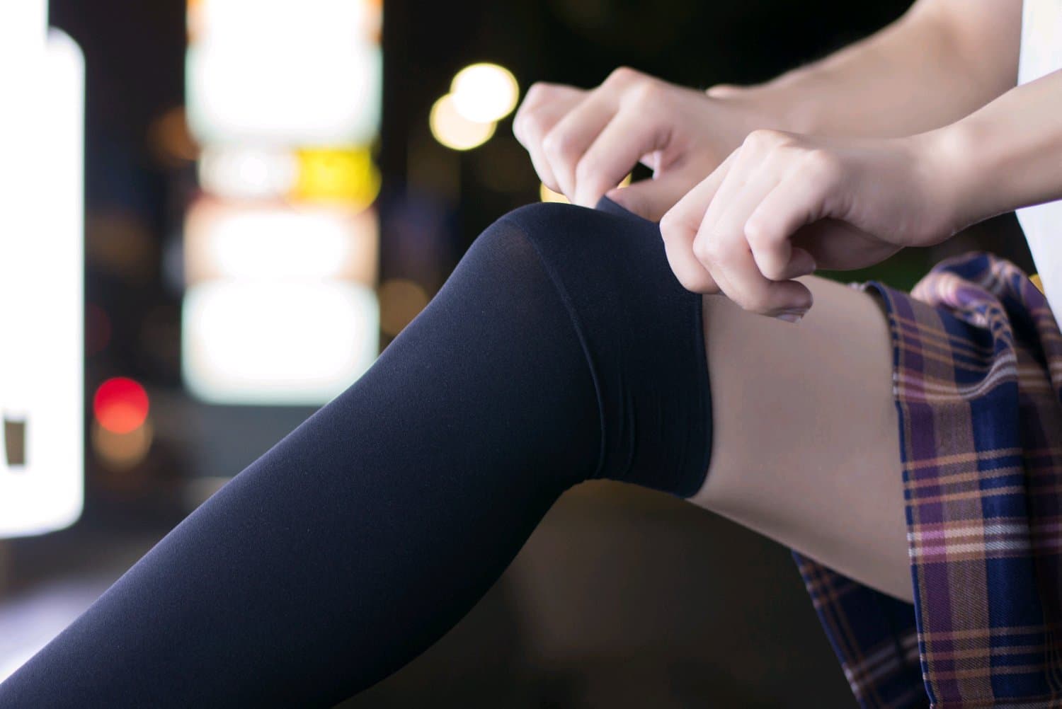 Feet wriggling in sheer stockings