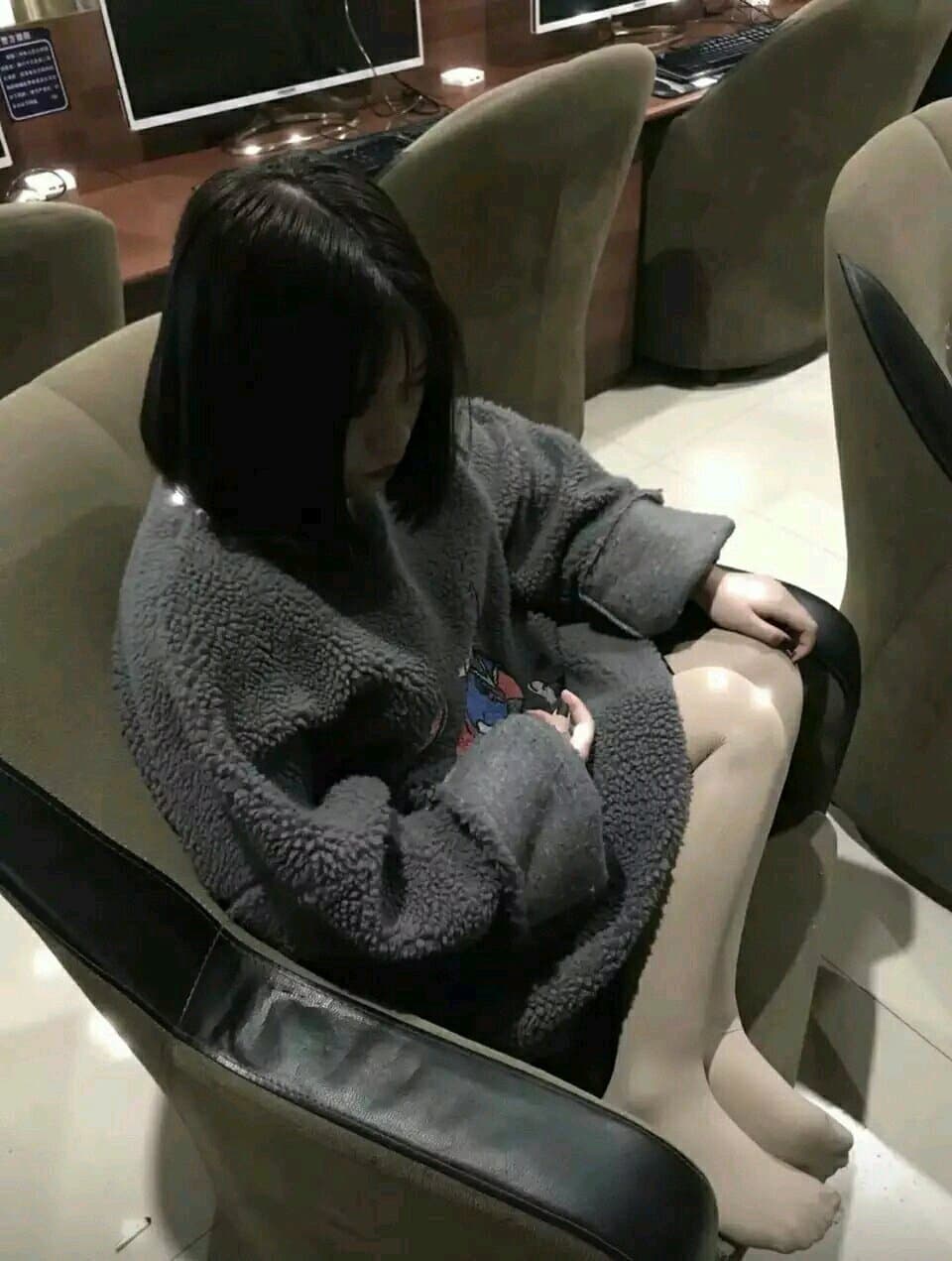 Bare foot resting on rumpled sheets