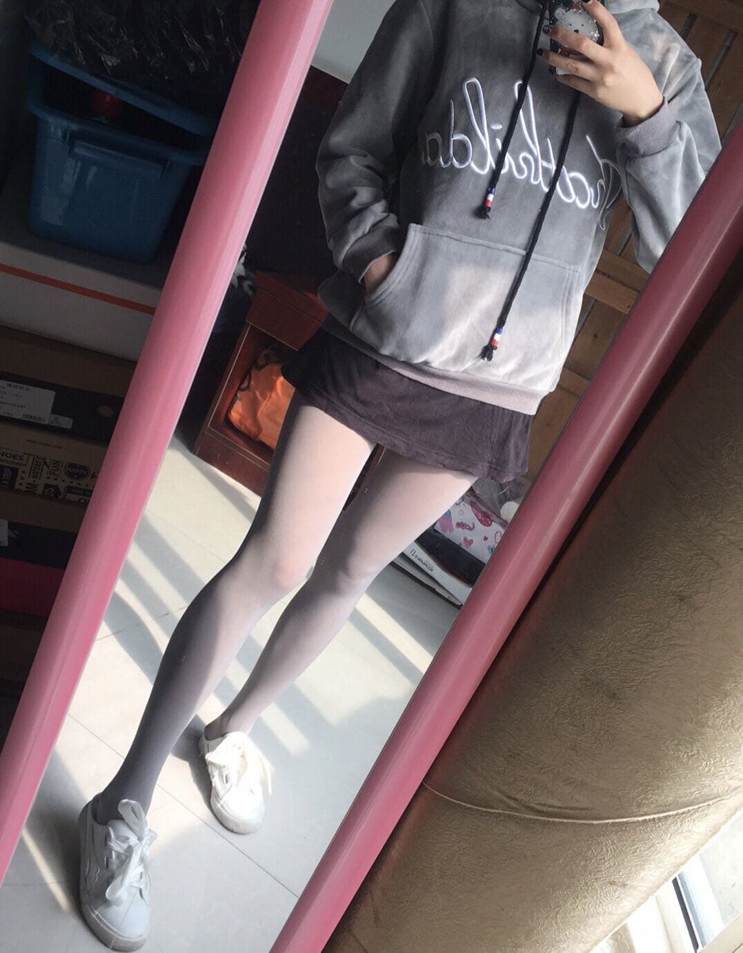 Series-style image of feet shown in different states: bare, stockinged, and in worn socks