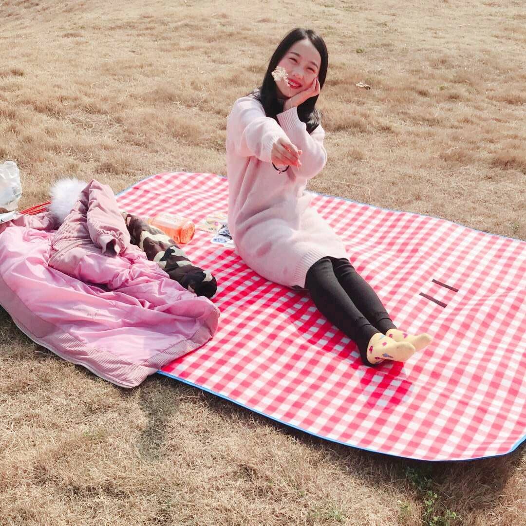 Adult mentor crossing legs, hosiery visible with stocking edge slightly rolled, feet poised on carpeted classroom-style chair.