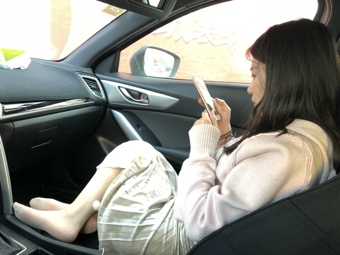 bare feet slipping from low heels, stocking sheen