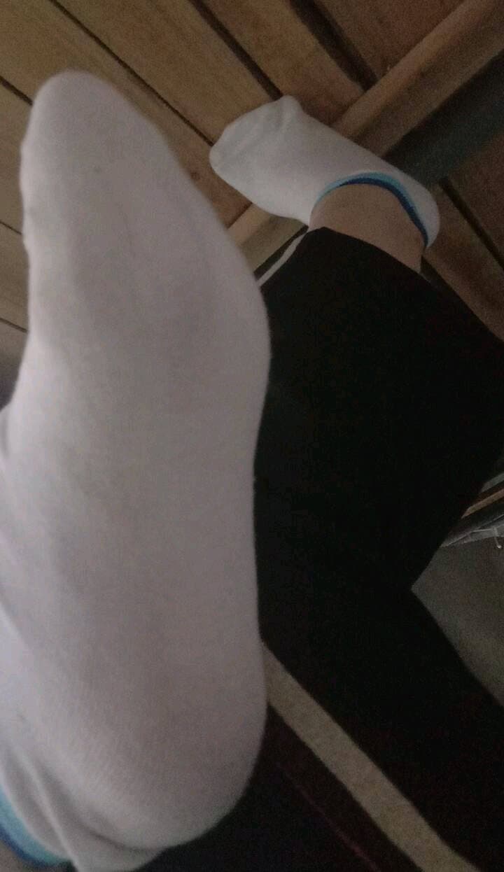 Coy foot peeking from stocking