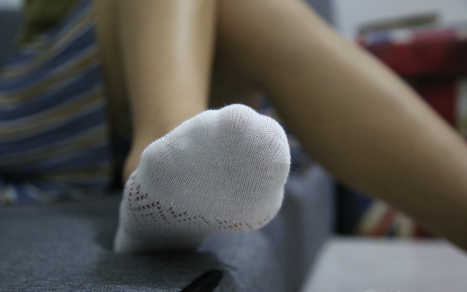 Foot adorned with lace stocking