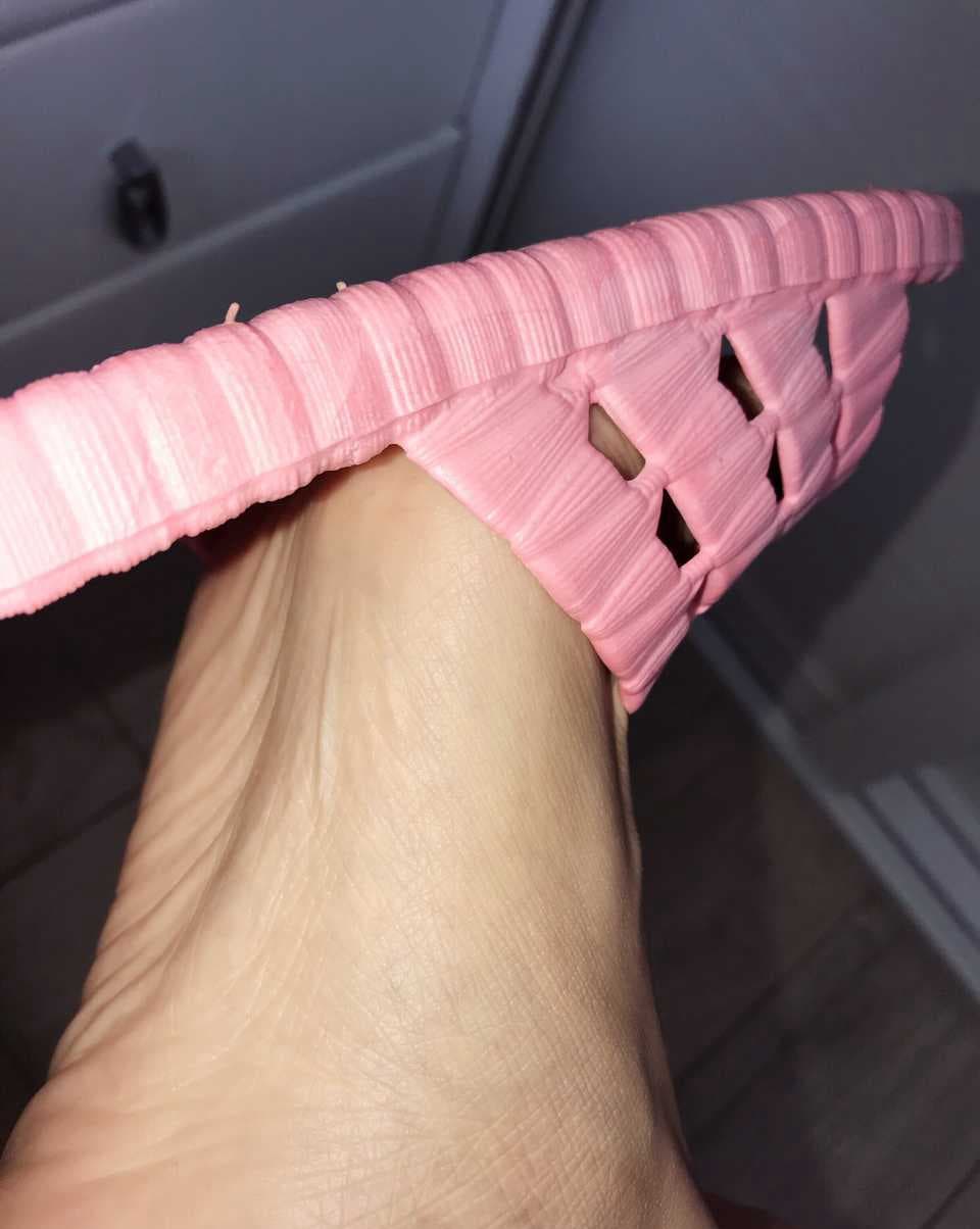 Sun-kissed bare feet in flip-flops