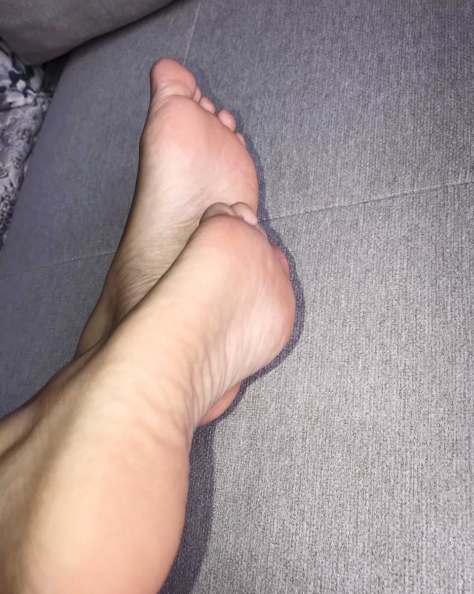 Bare toes against milk white