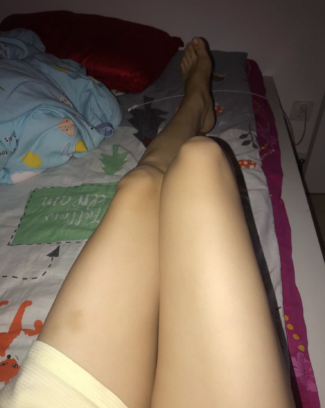 Close-up of bare soles pressed together, toes relaxed and skin softly lit for a tender feel