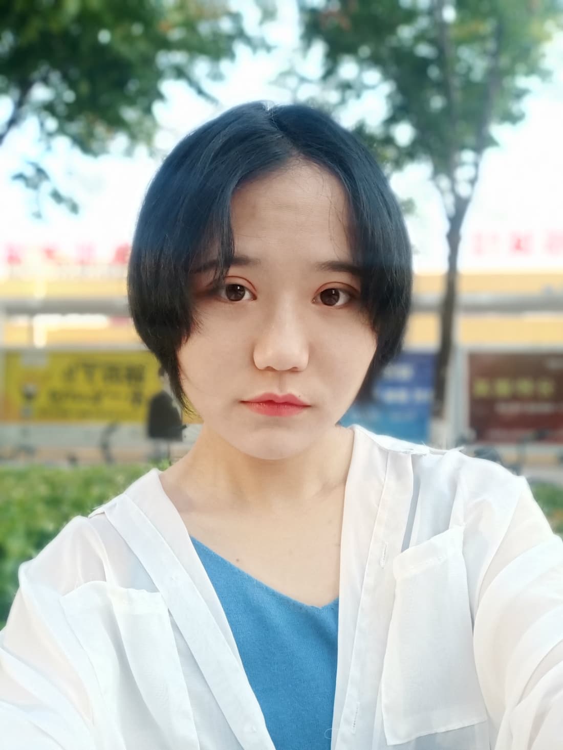 Shy feet in slightly oversized cotton socks, toes pressed together, a hint of nervous excitement in their posture.