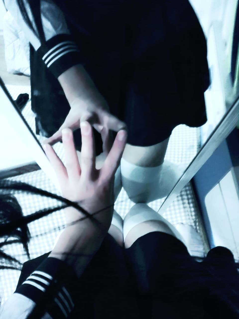 Casual scene of Jing Er's feet with cotton socks tossed aside, revealing soft arches and toes basking in warm light.