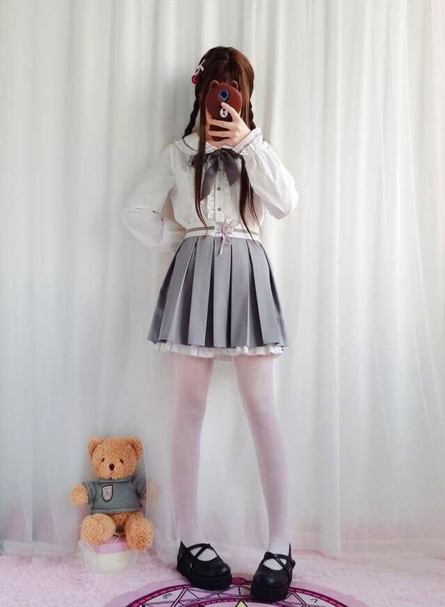 Playful scene with stockinged feet and a teasing sock pull, toes peeking out amidst soft, mischievous motion