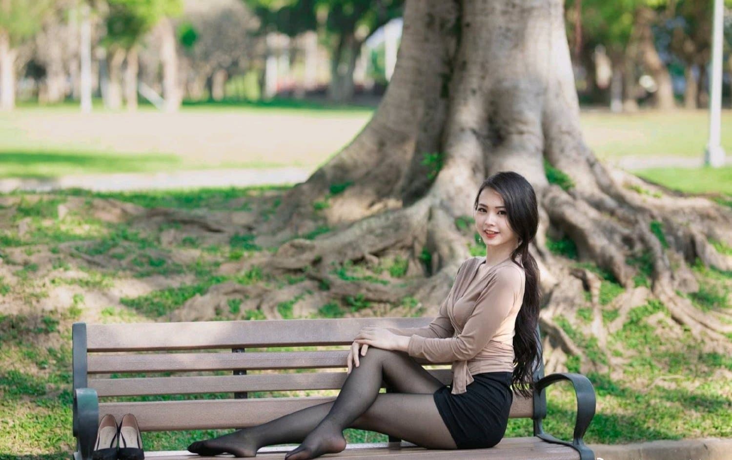 Elegant mature feet in sheer stockings, displaying confident arches and textured skin under soft lighting