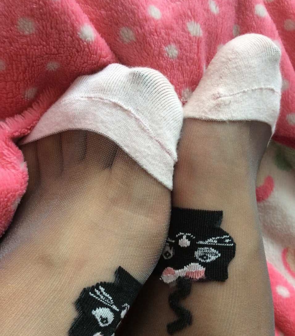 Striped sheer socks on feet