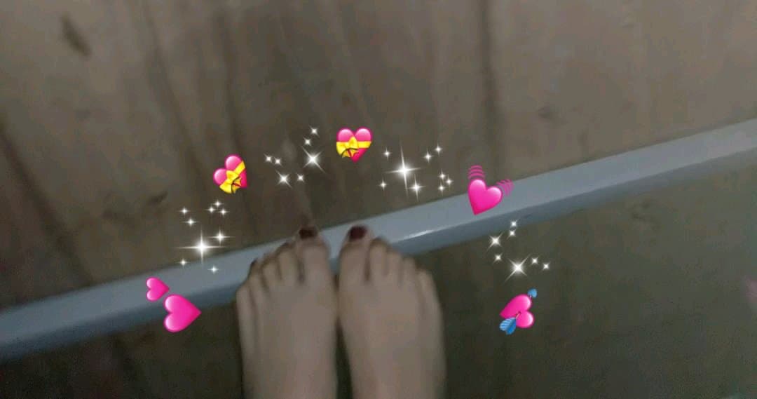 hesitant hand hovering near nylon-clad foot