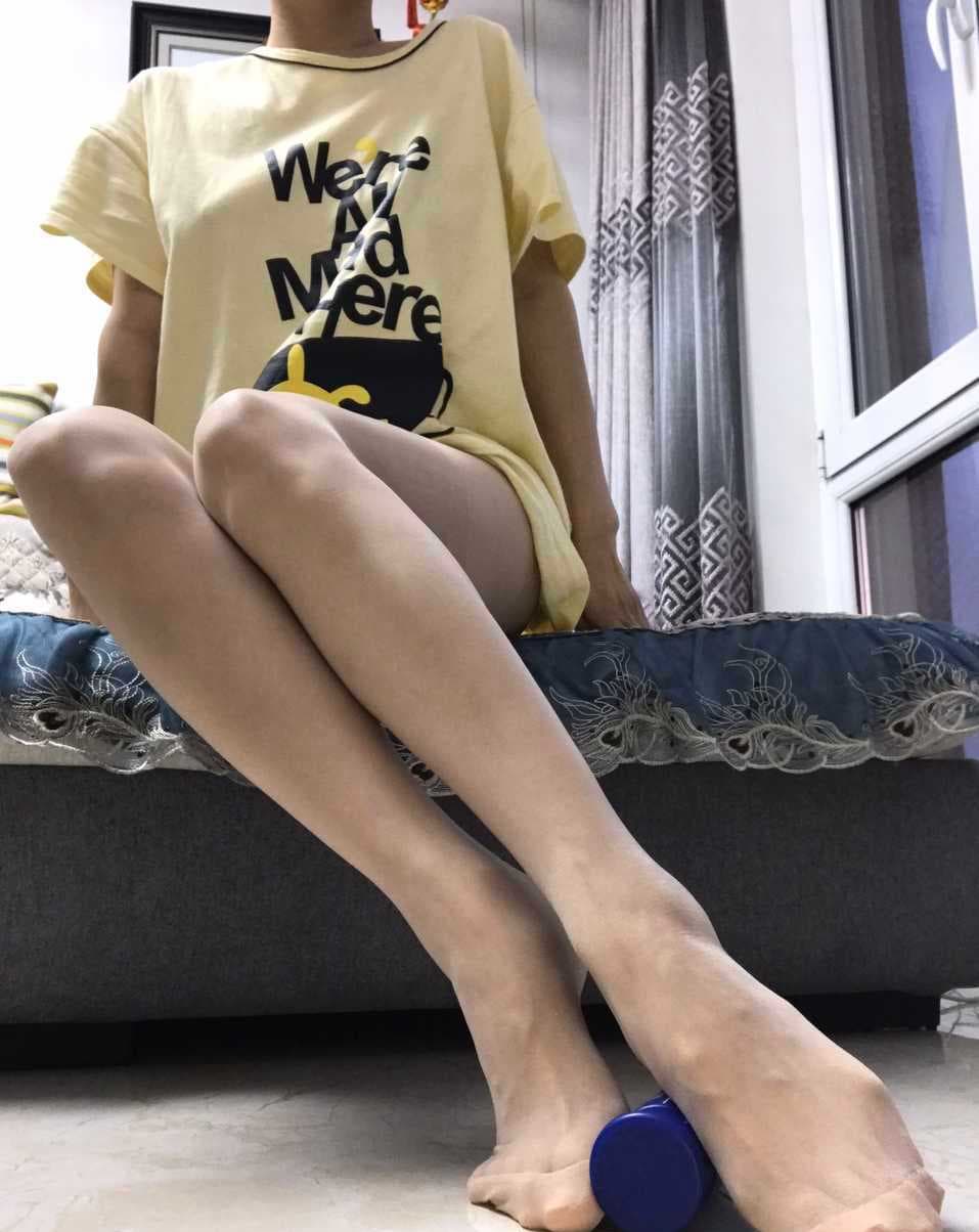 bare Asian feet on sofa