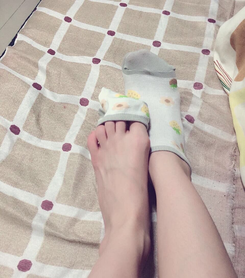 Pair of soft cotton socks, slightly worn and folded, suggesting recent, cozy use