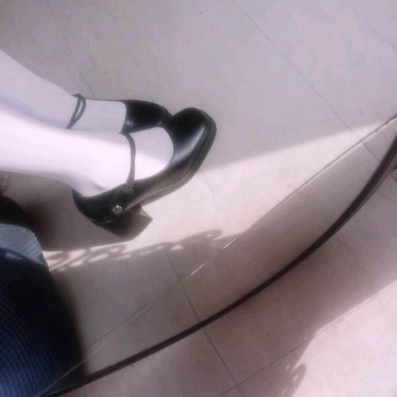 A casual pile of socks and nylons on a chair, soft textures hinting at recent wear and warmth