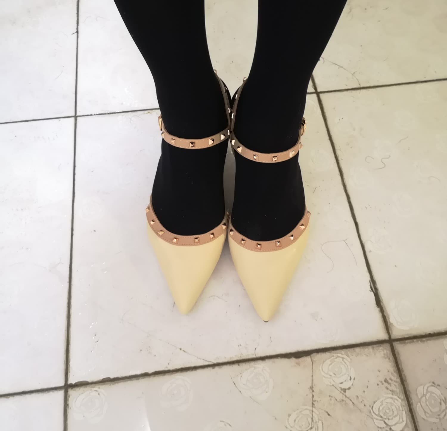 Introductory image of a bare foot slipping from a stocking, ankle exposed with soft ambient lighting