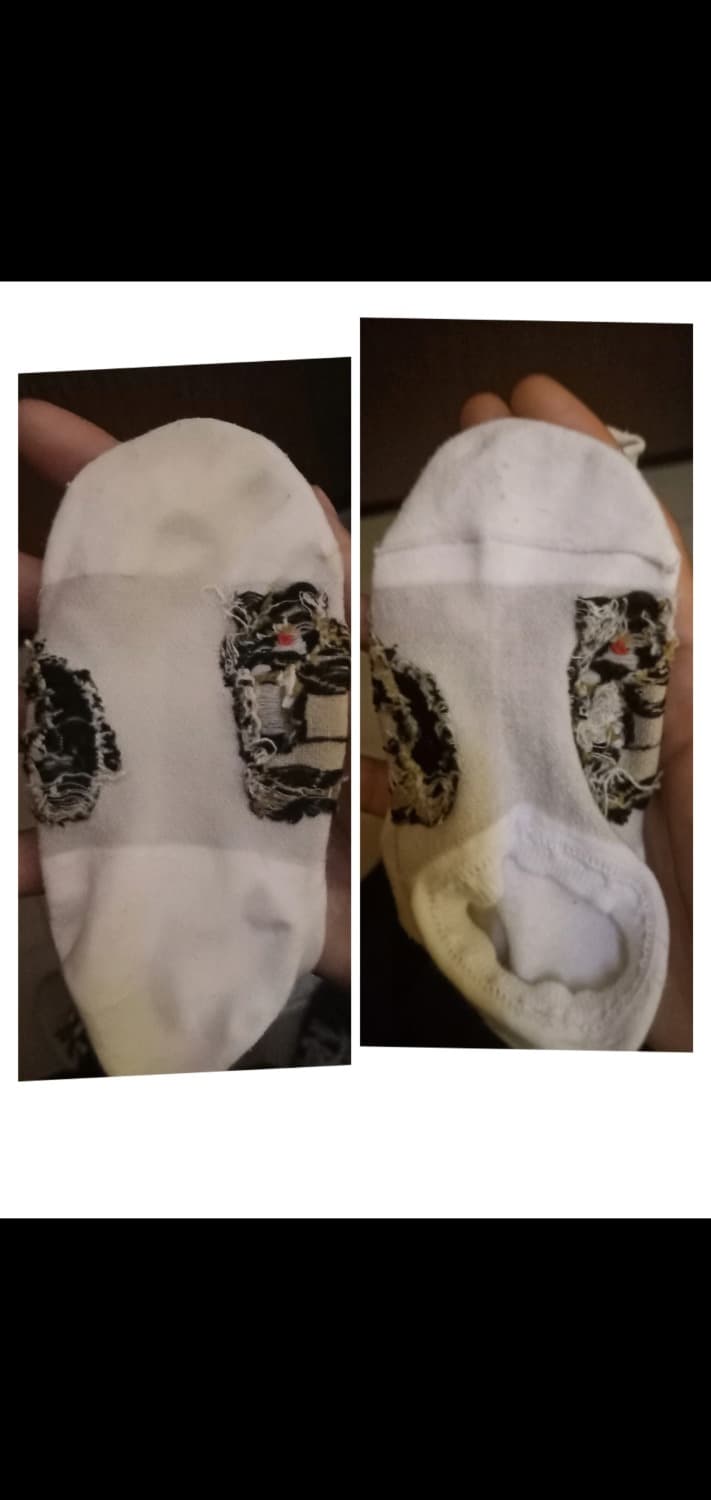 Close-up of bare soles and rolled-down nylons against flushed skin, summer light highlighting fine fabric texture