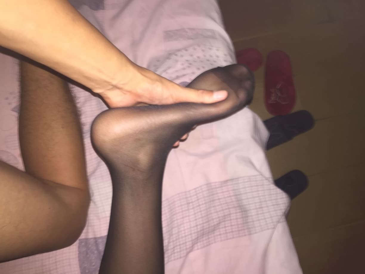 Wife's pantyhose-clad feet at desk