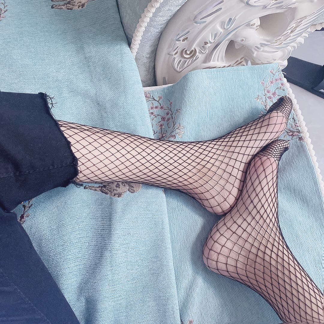 arch wrapped in black fishnet stocking