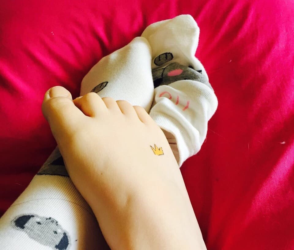 bare feet being gently washed