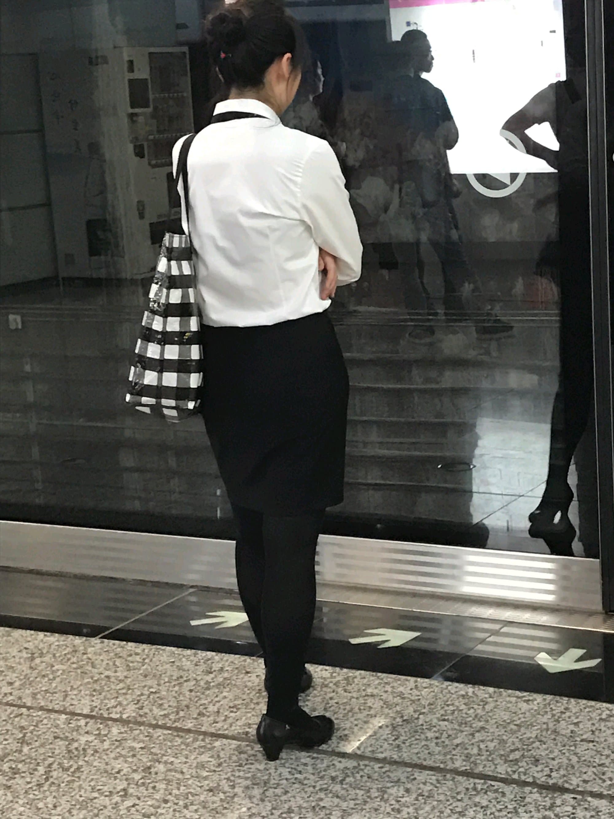 Kicking shoes by doorway