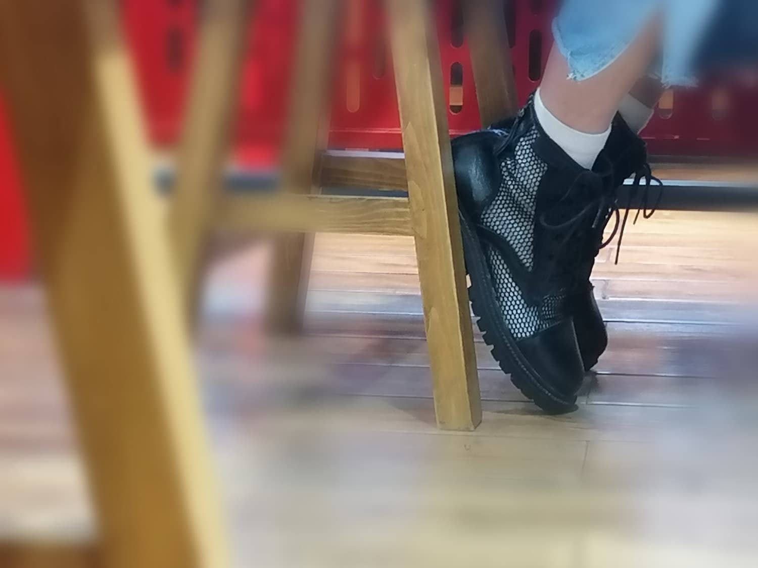 Assorted socks laid out with a barefoot casually slipping out of a cotton sock, showing subtle texture and warmth.