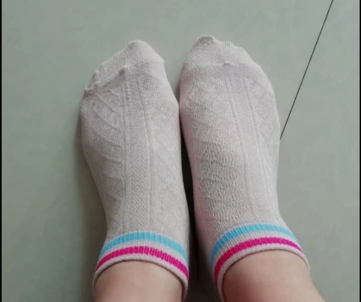 Three feet styles side by side: sheer stockings, naked skin, and cozy cotton socks in soft lighting