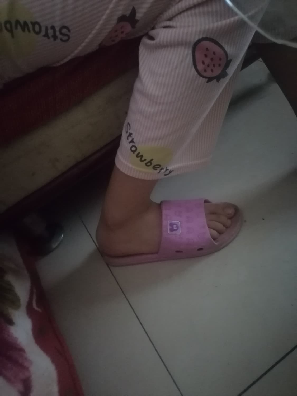 Partner’s bare soles with glossy nylon sheen