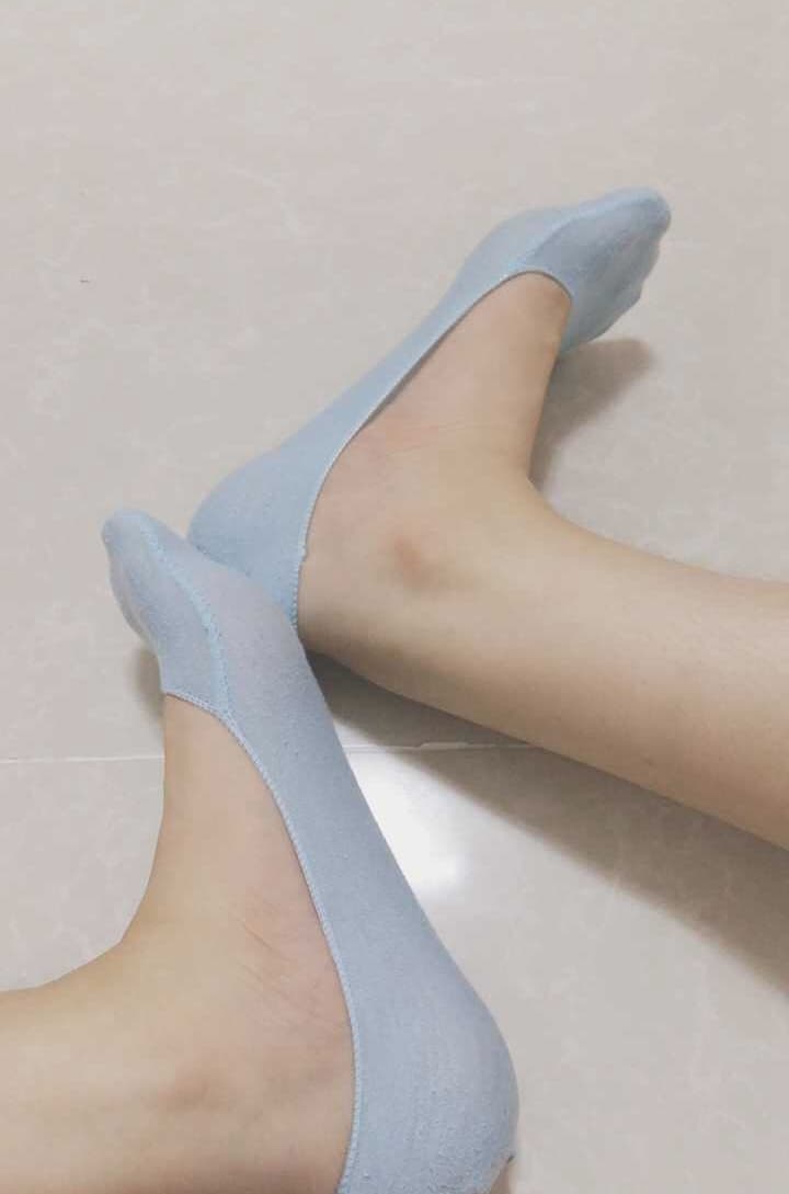 bare feet in nylon socks