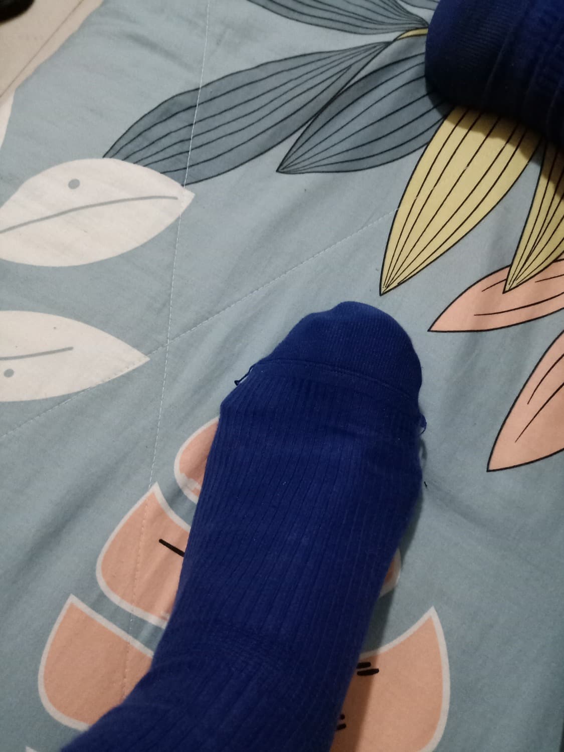 stockinged feet on bed