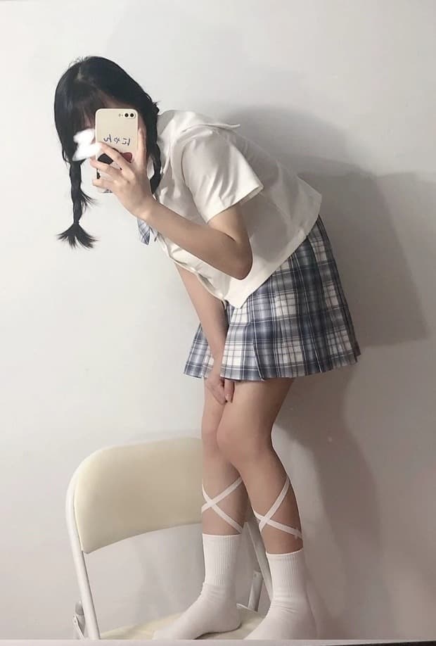 Feet half-slid from ribbed socks, toes exposed and curled, capturing the intimate texture of worn fabric