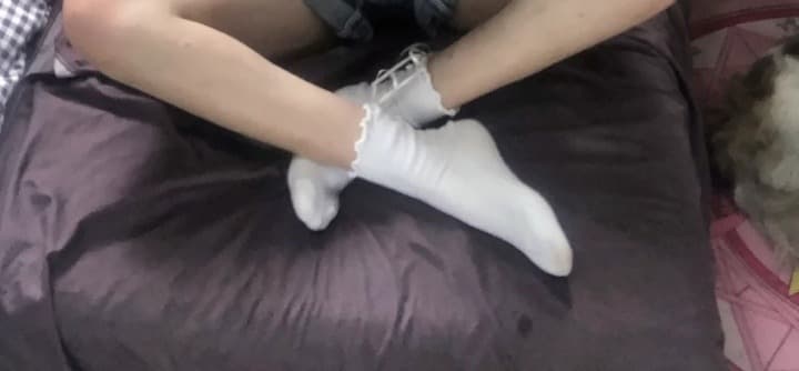 Artful close-up of foot arch and slender toes, soft lighting emphasizing skin texture and graceful curve