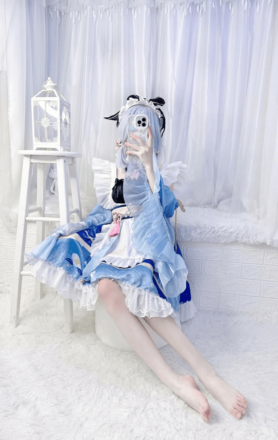 Cosplayer portraying a fantasy character, sitting with bare feet and delicate stocking details, toes flexed and costume fabrics draped around legs